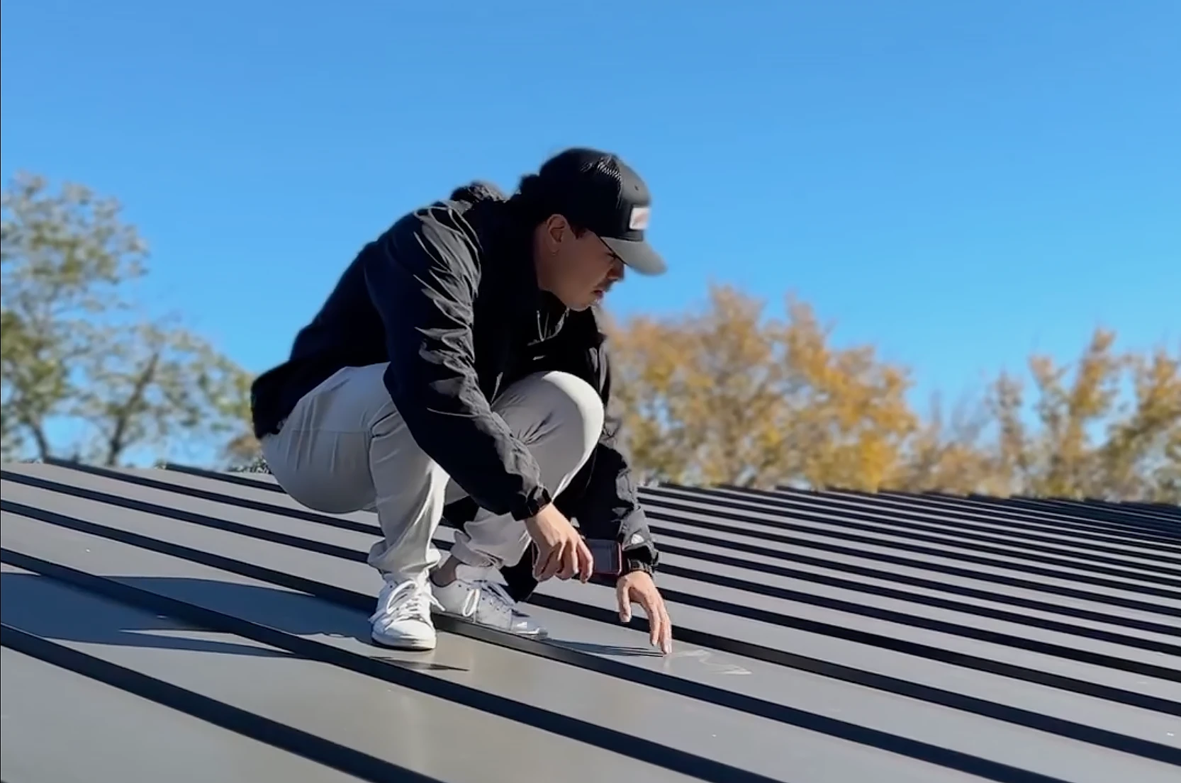 Chase Coats from Roam Roof and Solar Sales Specialist inspecting a roof.