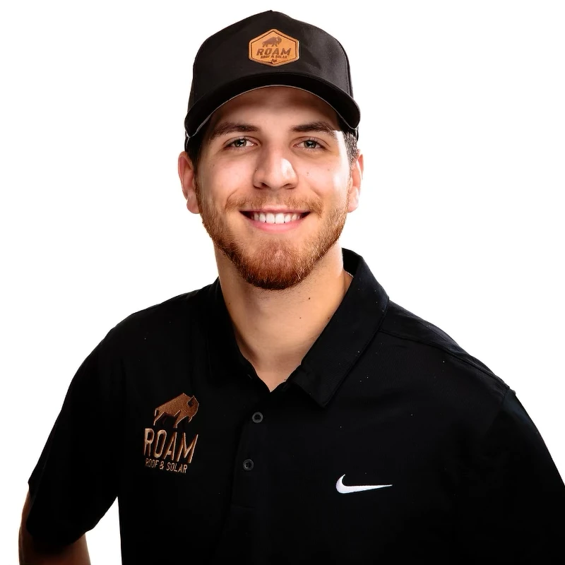 Headshot of Tanner Holman - Roofing Specialist from Roam Roof & Solar in Belton TX. He's wearing a black shirt with the Roam Roof and Solar logo on it.