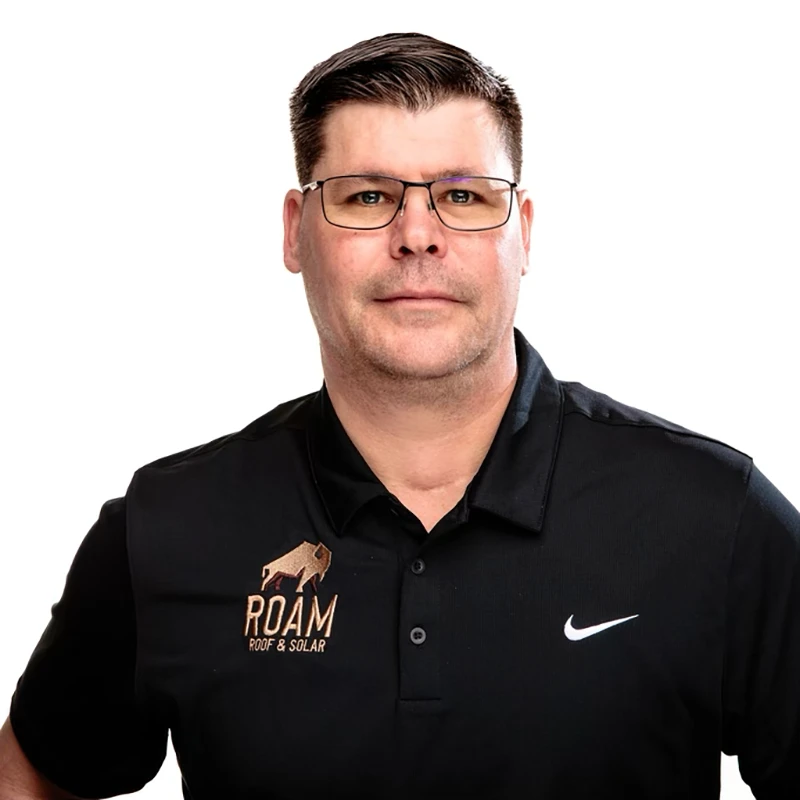 Headshot of Tony Rives - Director of Operations of Roam Roof & Solar in Belton TX. He's wearing a black shirt with the Roam Roof and Solar logo on it.